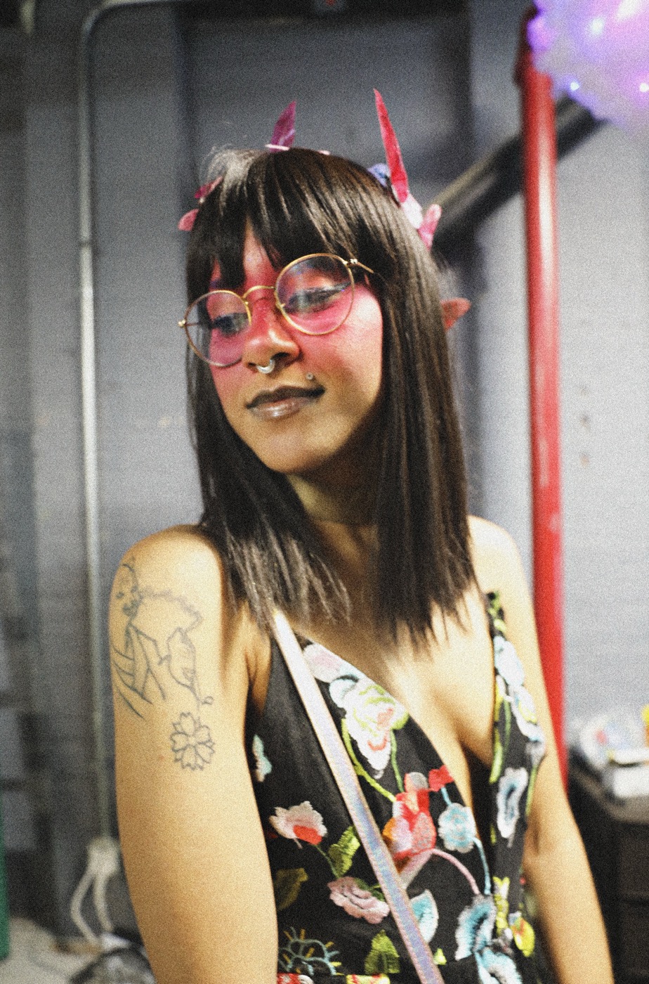 Film-grain portrait with paper cranes in hair